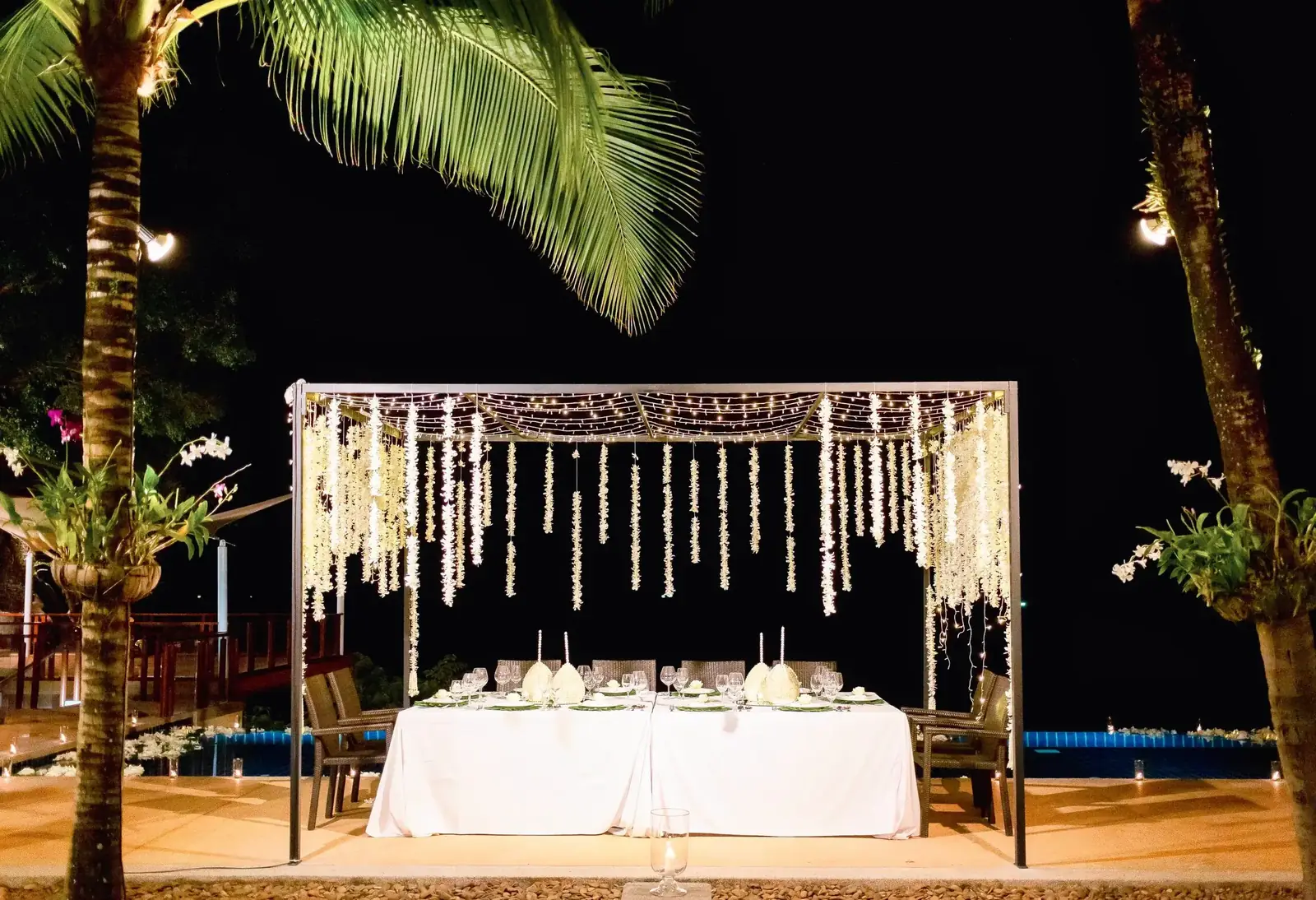 Floral canopy dinner table at night