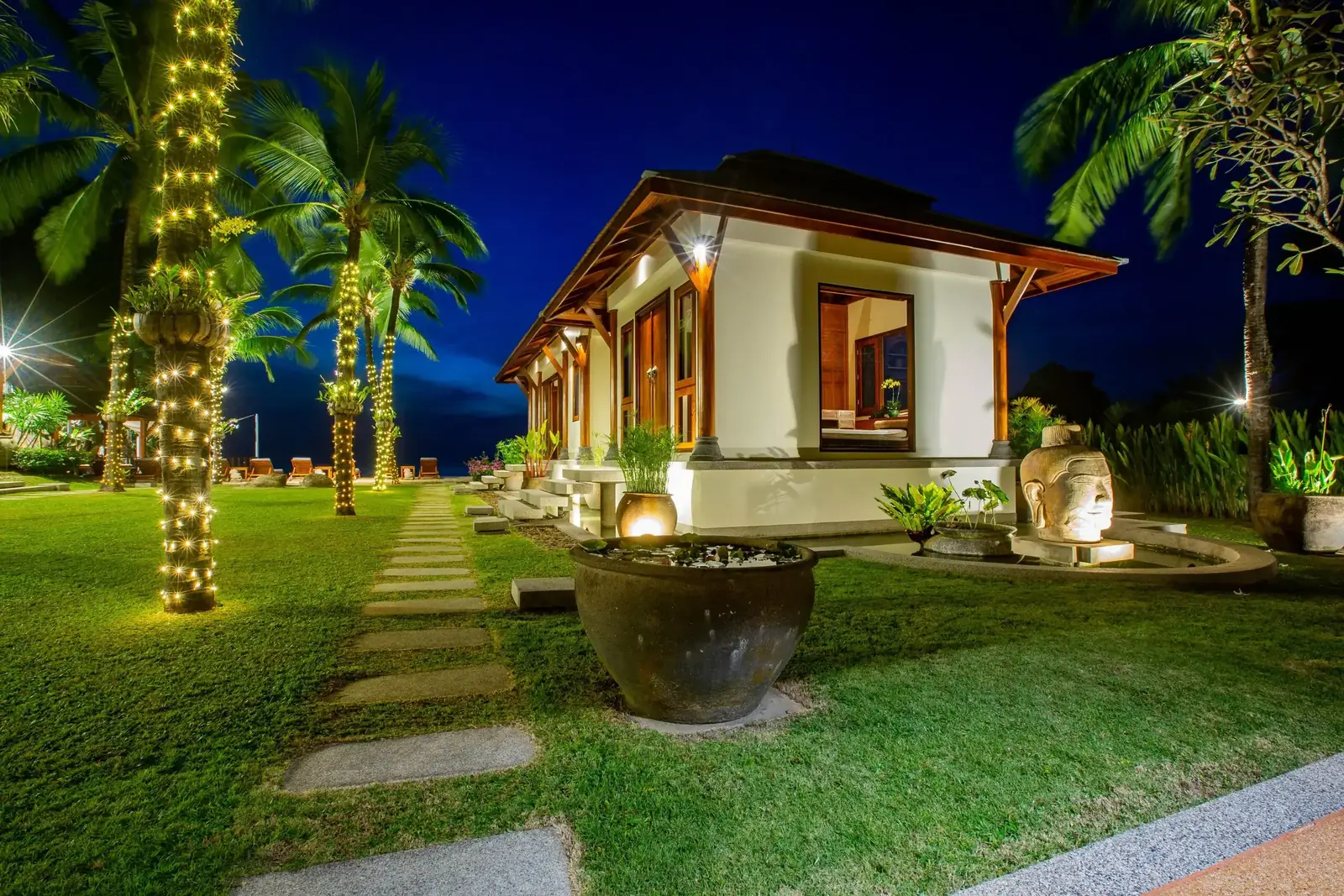 Guest pavilion and garden path at night