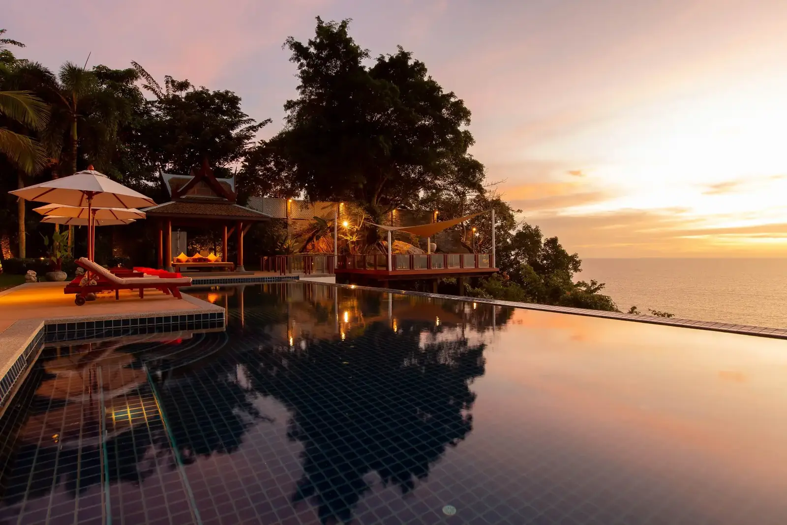 Infinity pool reflections at sunset