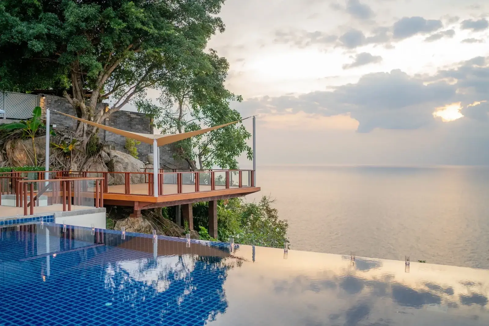 Pool and dining deck at sunset
