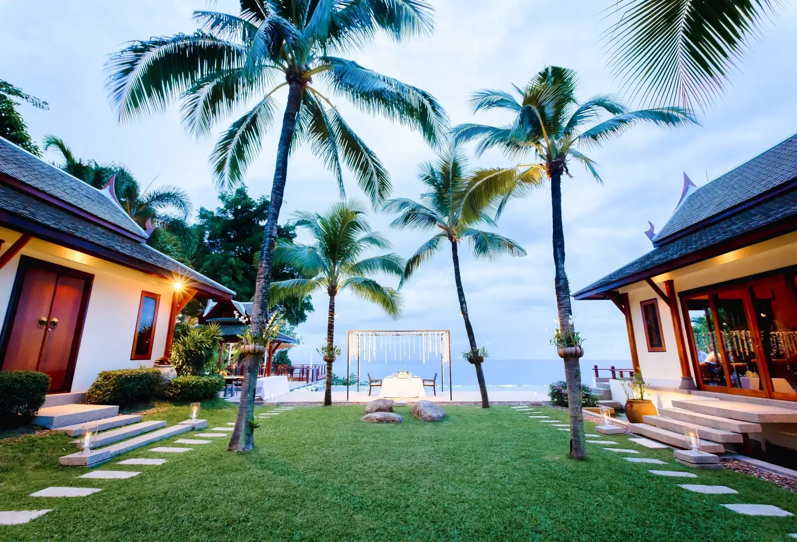 Private dinner setup on the oceanfront lawn